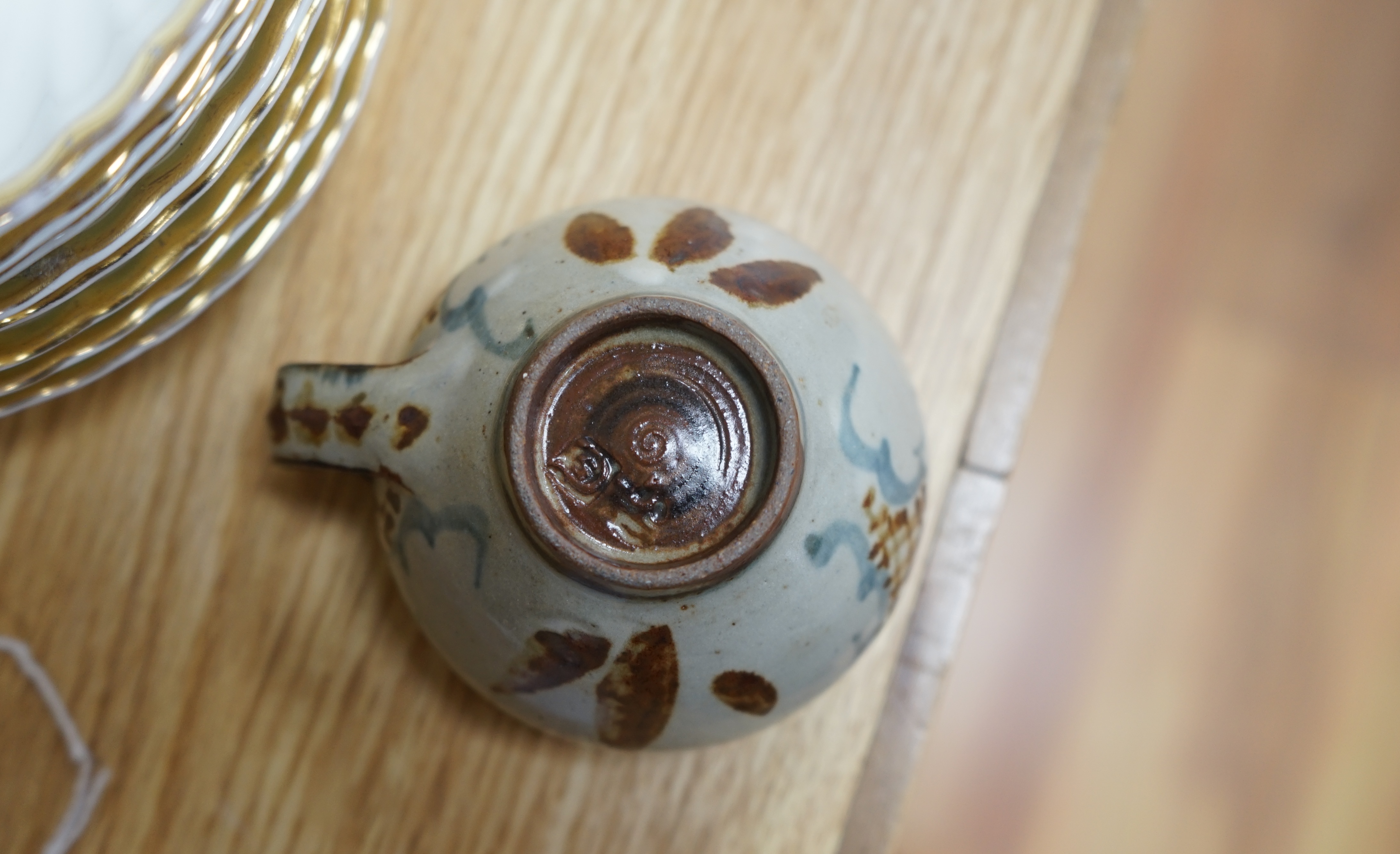 Three pieces of glazed studio pottery comprising a bowl, vase, and a cup and saucer by Seth Cardew, stamped to the base, largest 19cm in diameter. Condition - good